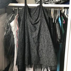 Tea-length black brocade dress with crinoline